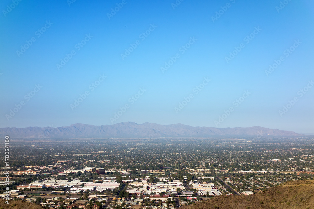 West side of Valley of the Sun looking at Glendale, Peoria and Phoenix as seen from North Mountain Park, Arizona. Copy space.
