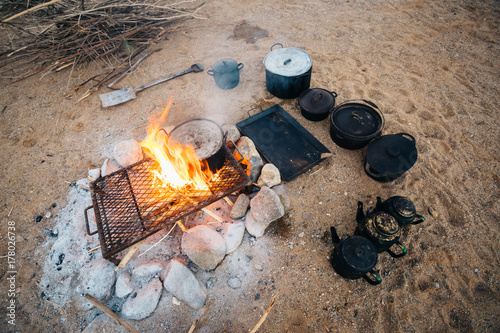 Outdoor camp fire cooking in the desert photo