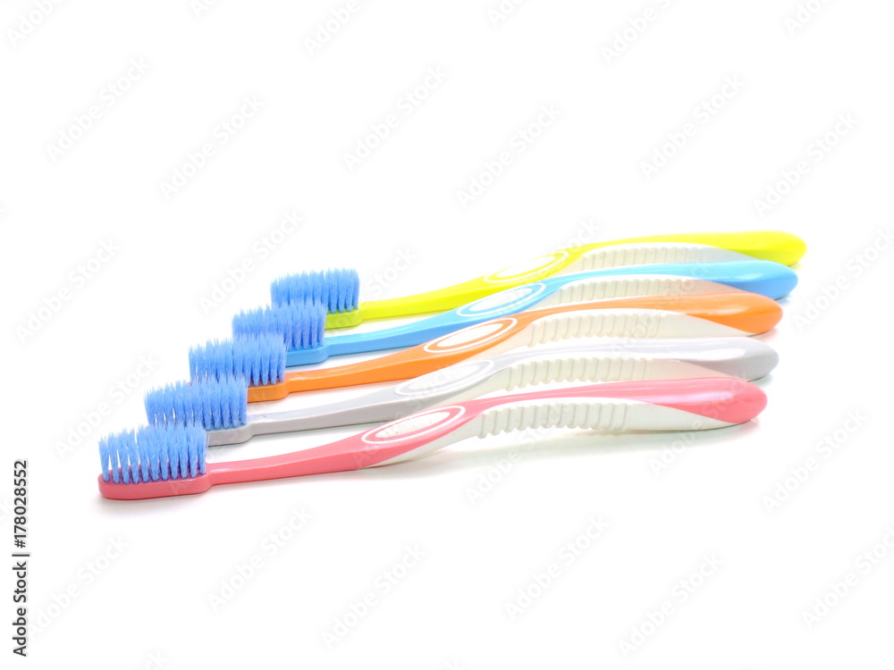 multicolored toothbrushes isolated on white background multicolored toothbrushes isolated on white background