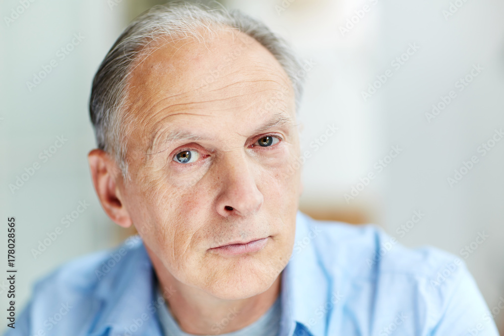 Face of mature man looking at camera with calm expression Face of mature man looking at camera with calm expression