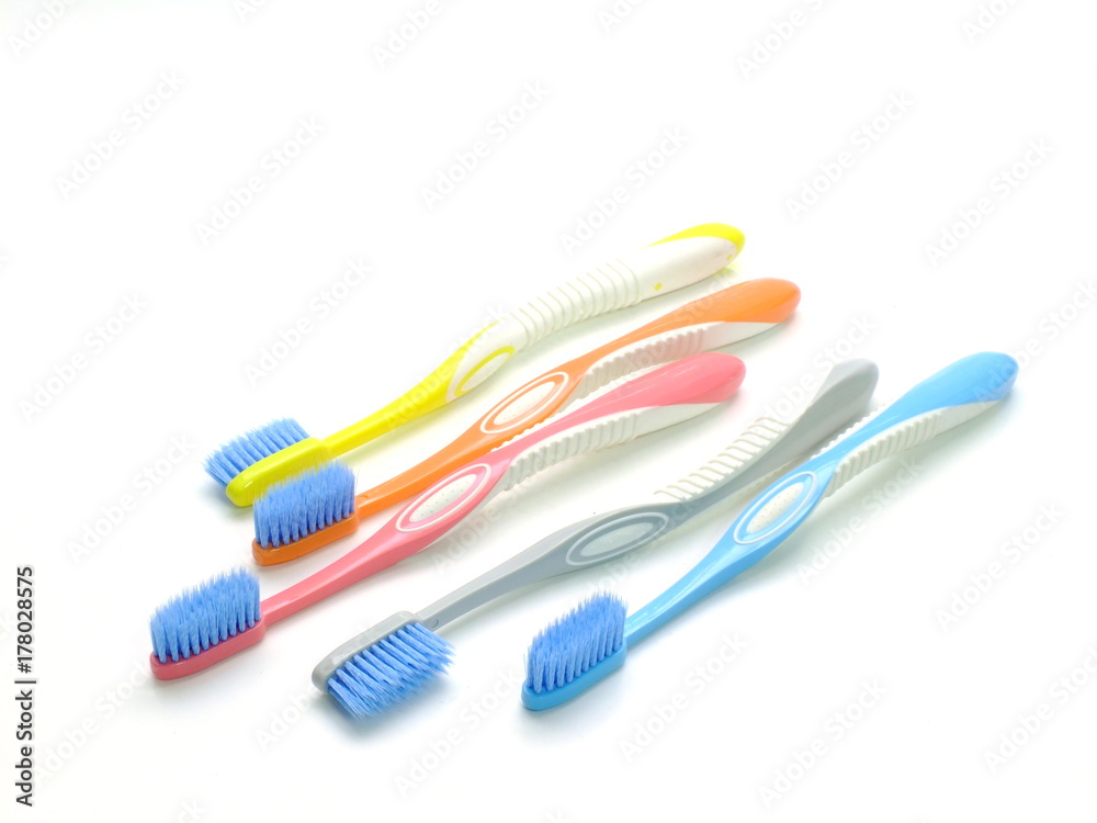 multicolored toothbrushes isolated on white background multicolored toothbrushes isolated on white background