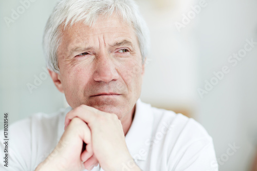 Wallpaper Mural Grey-haired pensive man with his hands by chin looking aside Torontodigital.ca