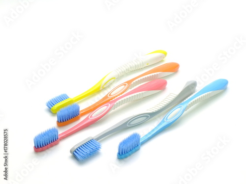 multicolored toothbrushes isolated on white background