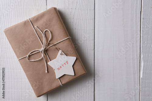 Christmas present wrapped with plain brown paper