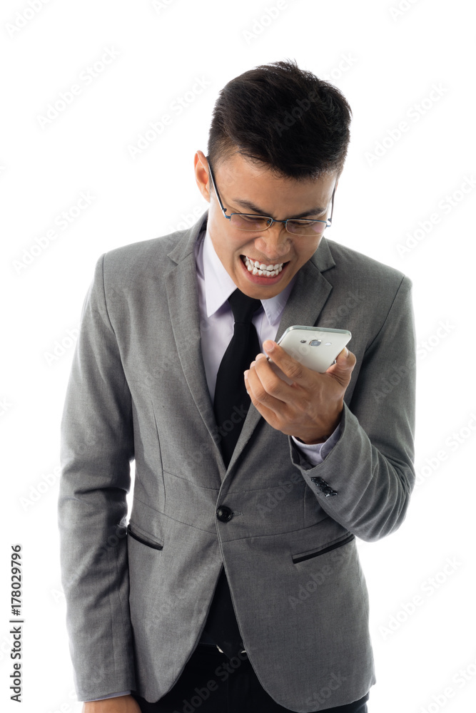 Portrait of an angry business man with glasses and smart phone. Isolated on white background Portrait of an angry business man with glasses and smart phone. Isolated on white background