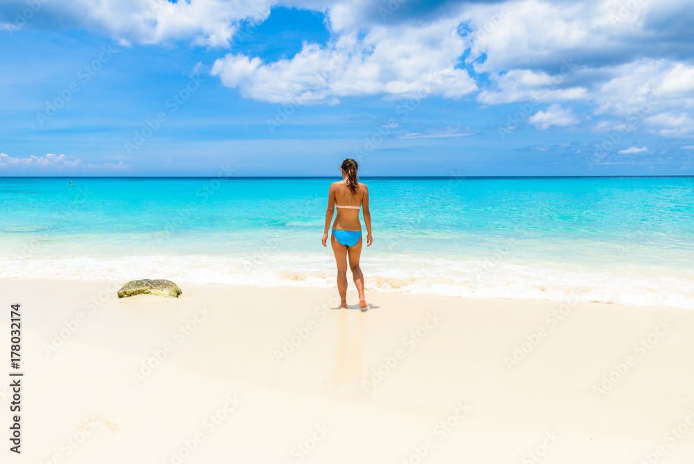 Girl at Grote Knip beach, Curacao, Netherlands Antilles - paradise beach on tropical caribbean island