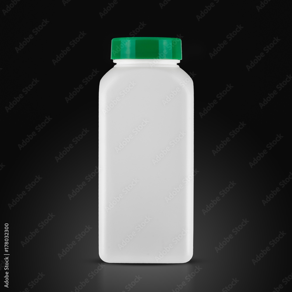medicine white pill bottle isolated on a black background medicine white pill bottle isolated on a black background