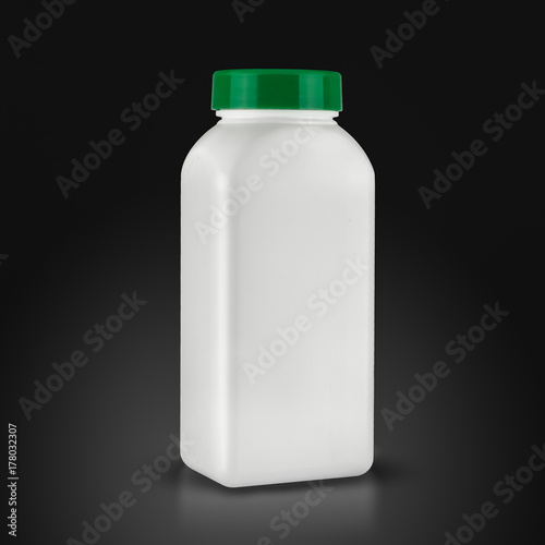 medicine white pill bottle isolated on a black background