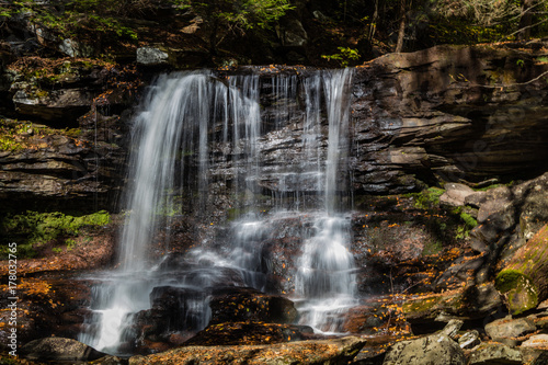 Waterfalls are surrounded by colorful fall foliage at Ricketts Glen State Park in Benton  PA