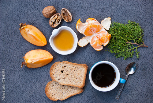 Healthy breakfast with toast, honey and black coffee. Food background. © Etnika