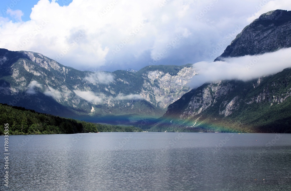 lake with rainbow above
