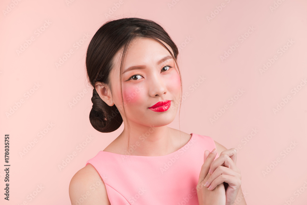 Beauty fashion portrait. Smiling young asian woman on pink background. Beauty fashion portrait. Smiling young asian woman on pink background.