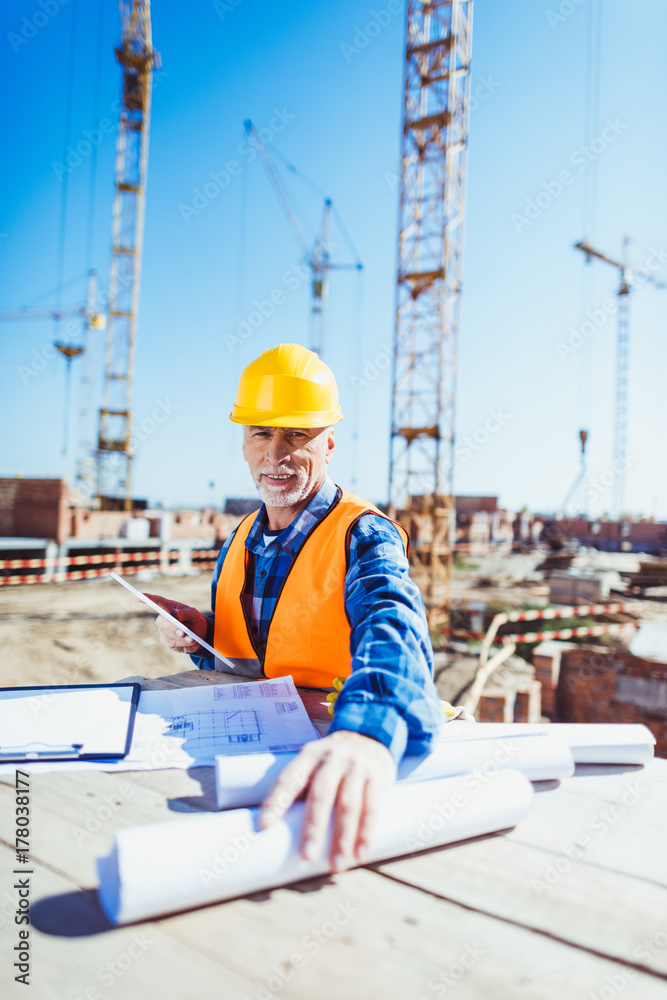 construction worker with building plans construction worker with building plans