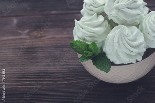 Mint Marshmallow or zephyr in the bowl with a leaf of mint