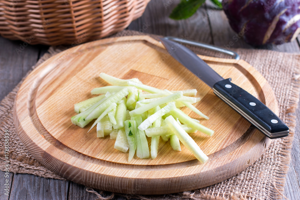 Cucumber slices on wooden background