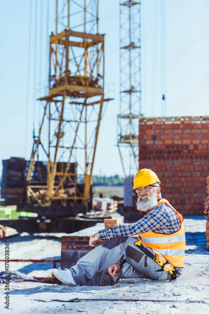 worker in protective wear at construction site worker in protective wear at construction site