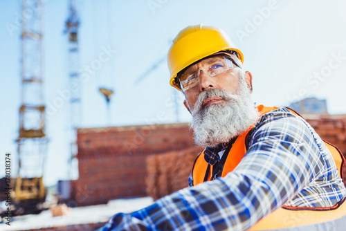 worker in protective wear at construction site