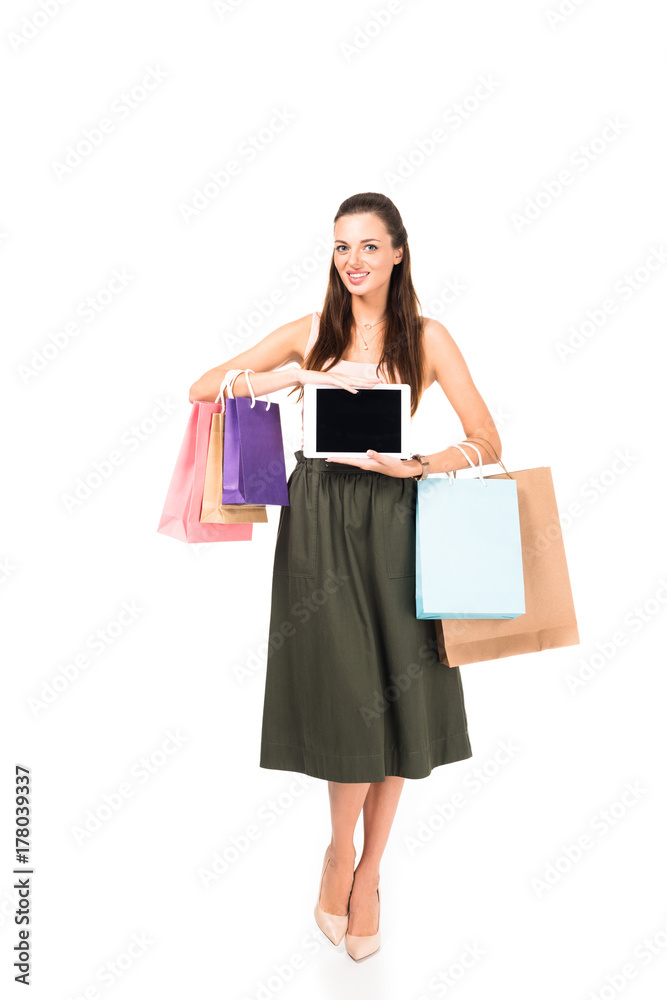 woman with shopping bags and tablet
