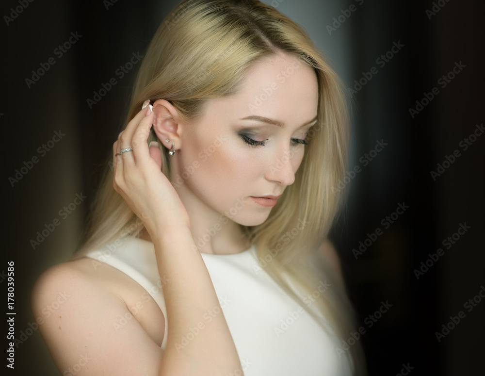 Portrait of a beautiful young woman with blue eyes. Portrait of a beautiful young woman with blue eyes.