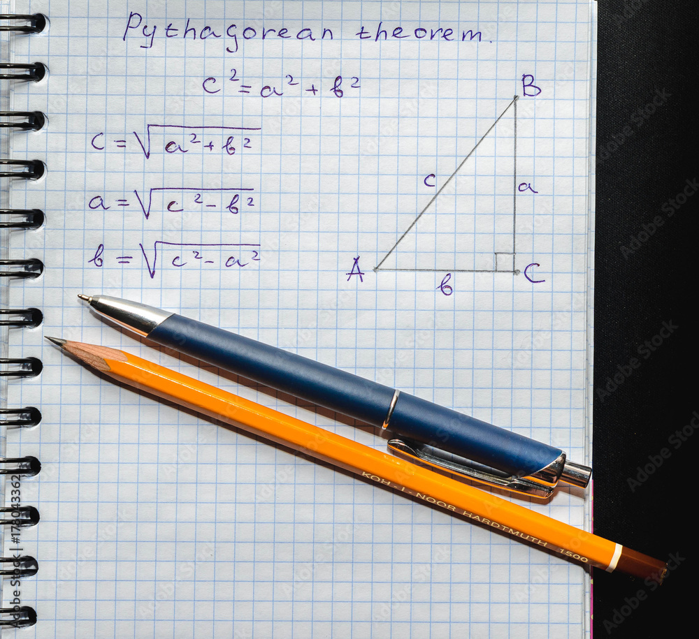 Page with formulas and the Pythagorean theorem with pen and pencil Page with formulas and the Pythagorean theorem with pen and pencil