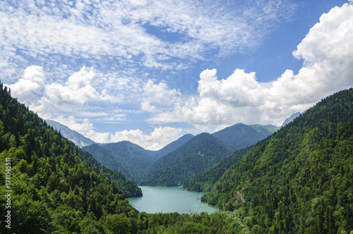 High-altitude lake Ritsa in Abkhazia in summer on a sunny, hot day. © dmitriydanilov62