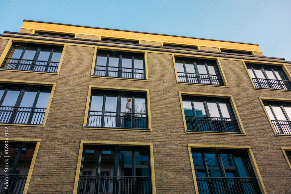 brick apartment building with square windows