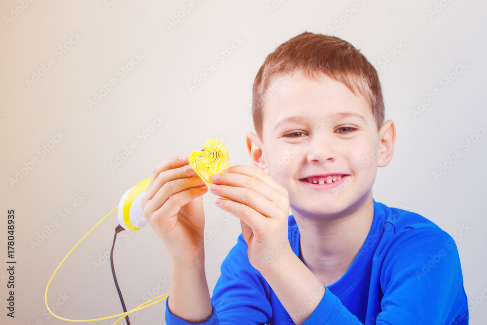 Child with 3d printing pen. Creative, technology, leisure, education concept Child with 3d printing pen. Creative, technology, leisure, education concept