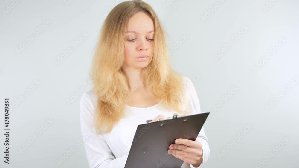 4k. Girl taking notes in the tablet. Isolated on white background. Mockup 4k. Girl taking notes in the tablet. Isolated on white background. Mockup