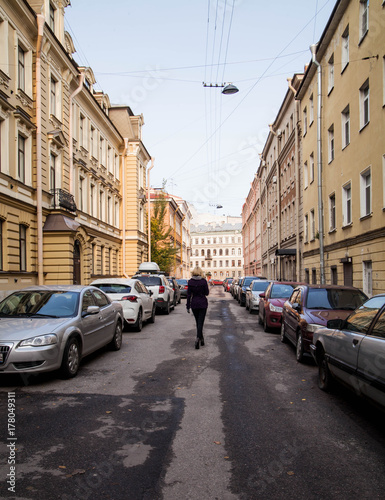 The girl is walking on a soft street. © Ксения Фалёва