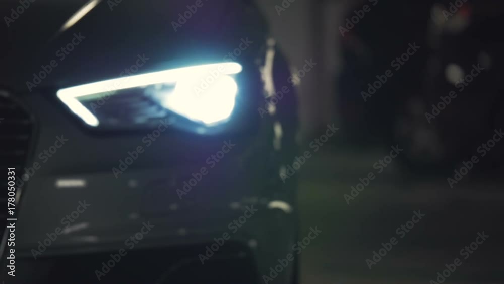 Car pulling up flashing headlights 