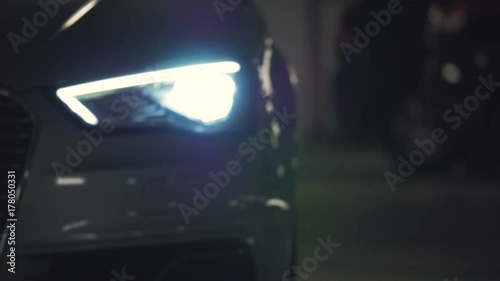 Car pulling up flashing headlights 