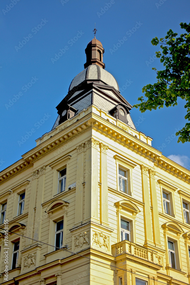 Historical building with spire / Neo-Renaissance building facade corner in Prague