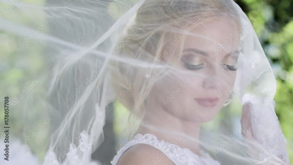 portrait of a bride close-up on wedding day. walk in the park portrait of a bride close-up on wedding day. walk in the park
