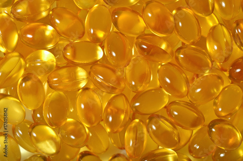 Omega-3 fish fat oil capsules as background