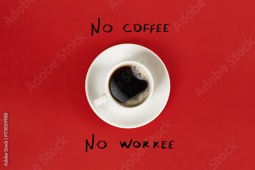 Top view of cup of black coffee and No coffee No workee lettering isolated on red background