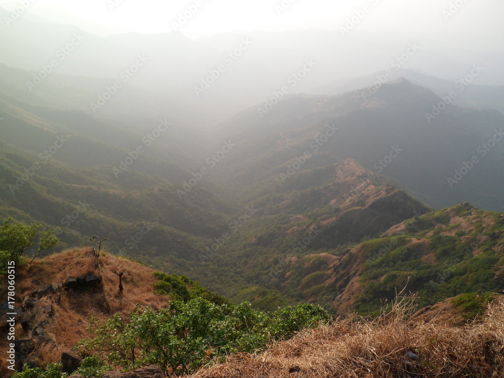 Hills view of  mahabelashwar (India) with background of hazy  blue sky