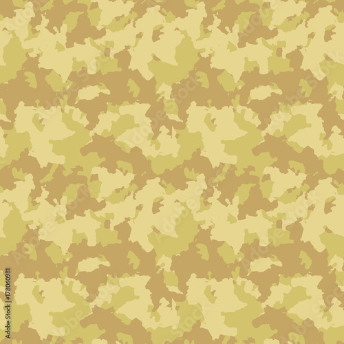 Yellow and beige desert camouflage is a masking seamless pattern that can be used as sand camo print for clothing and background and backdrop or computer wallpaper