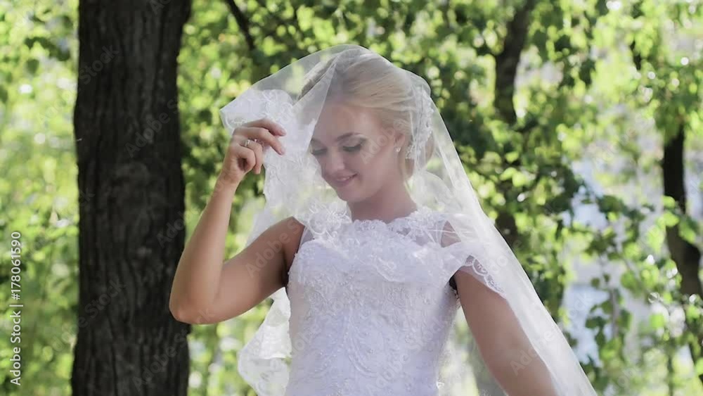 portrait of a bride close-up on wedding day. walk in the park portrait of a bride close-up on wedding day. walk in the park