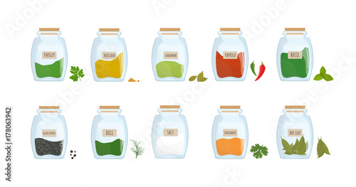 Collection of spices stored in clear closed jars isolated on white background...