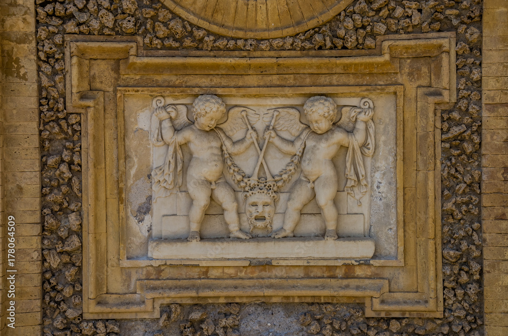 Ancient sculpture paintings on a fragment of the wall in the Villa Doria-Pamphili in Rome, Italy