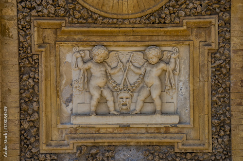 Ancient sculpture paintings on a fragment of the wall in the Villa Doria-Pamphili in Rome, Italy