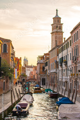 Sunset view with canal in Venice, Italy