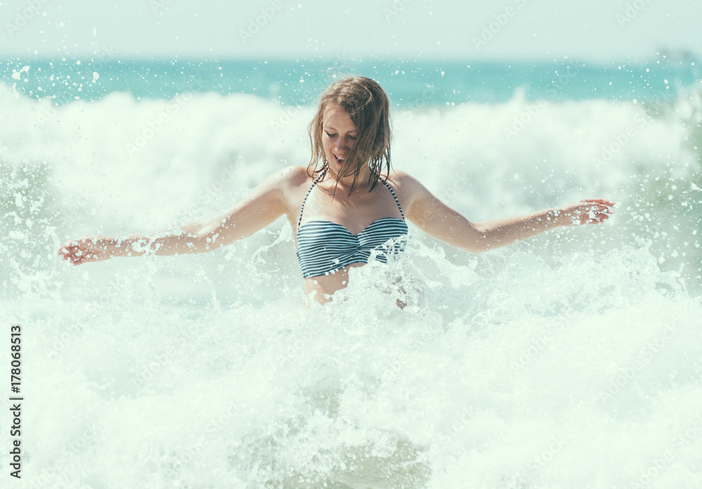 Happy woman having fun in the sea. Happy woman having fun in the sea.
