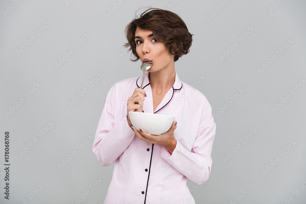 Obraz premium Portrait of an attractive young girl in pajamas