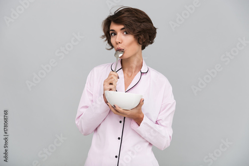 Cuadro en lienzo Portrait of an attractive young girl in pajamas