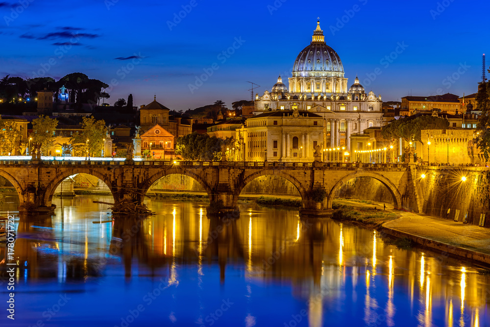 Night view of Basilica St Peter, bridge Sant Angelo and river Tiber in Rome. Italy