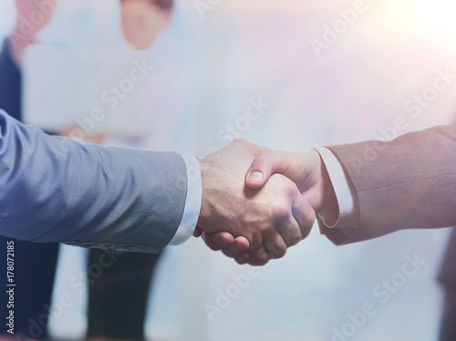 Business man shaking hand to partner