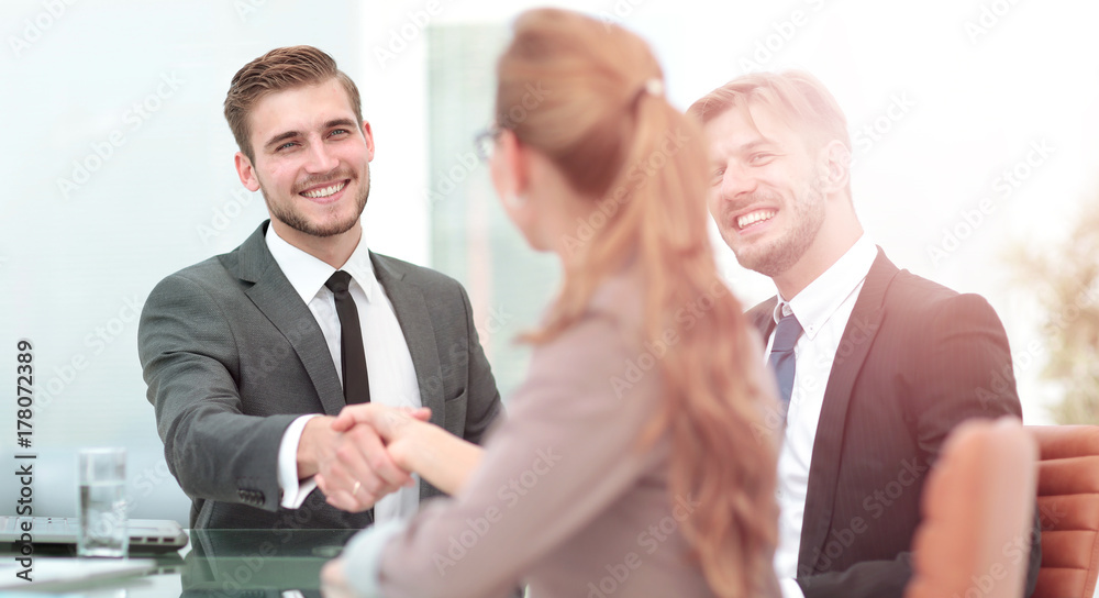 Business people shaking hands, finishing up a meeting Business people shaking hands, finishing up a meeting