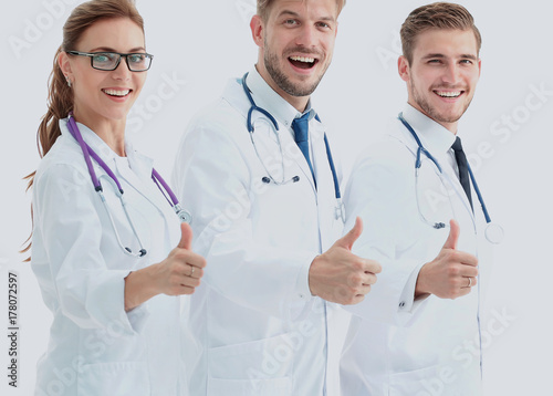 Portrait of an assertive medical team against a white background