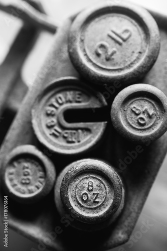 Cast iron weights on antique metal scales